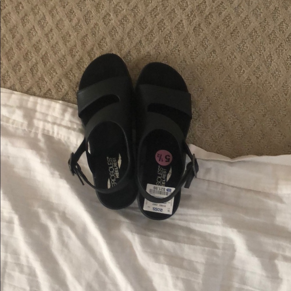 Shoes which are black and a little heeled